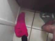 Brunette doing oral sex to black guy in restroom